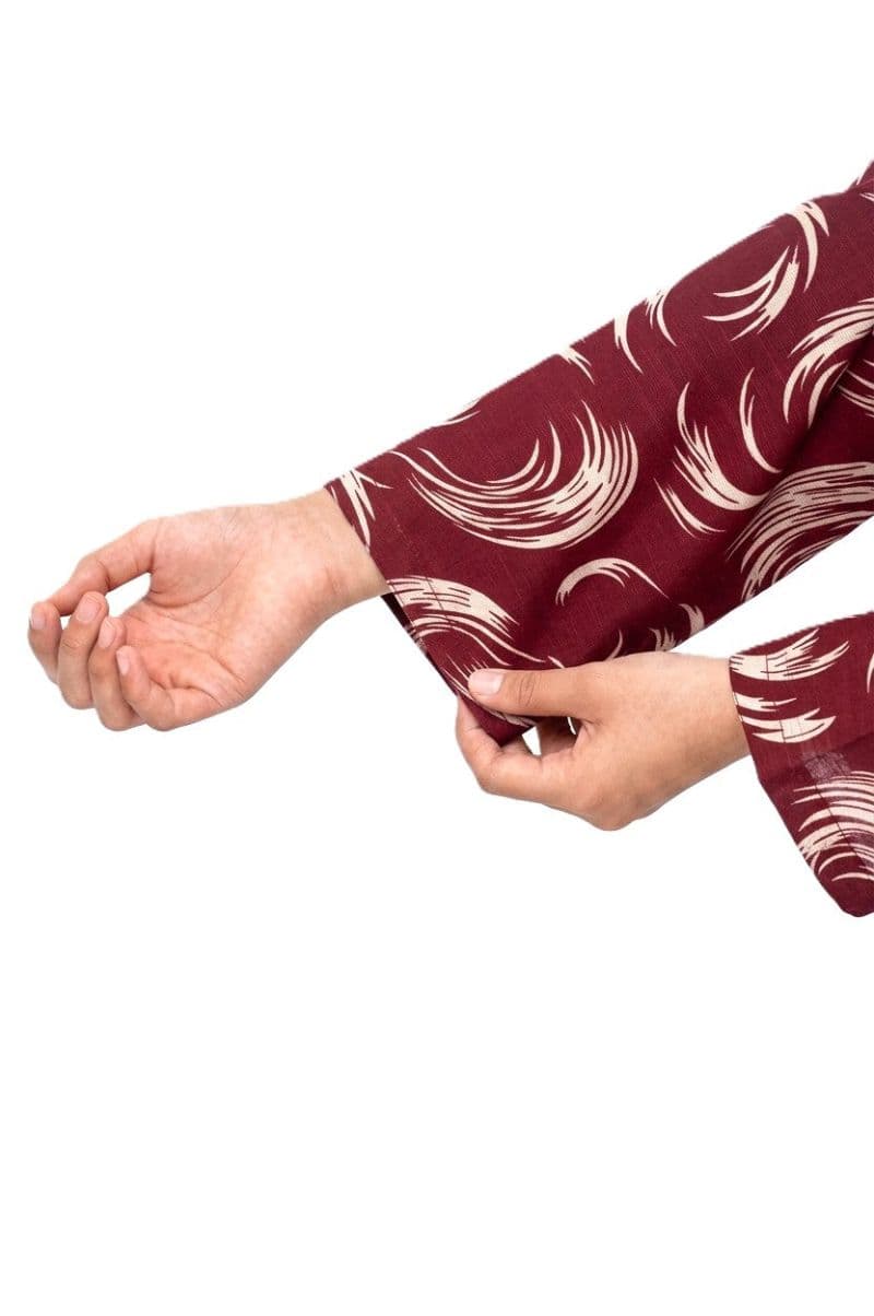 Plum Khaddar Maroon Colour Printed White Patterns with Maroon Buttons on 2pc stitched suit for Girls.