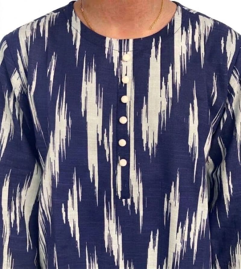Plum Khaddar Blue Colour Printed White Patterns with White Buttons on 2pc stitched suit for Girls.