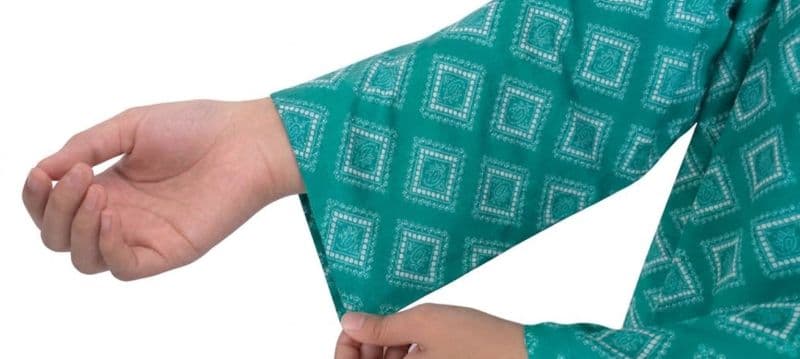 Plum Lilen (imported Fabric) Sea Green colour printed White Patterns with Sea Green buttons on 2pc stitched suit for Girls. thumbnail