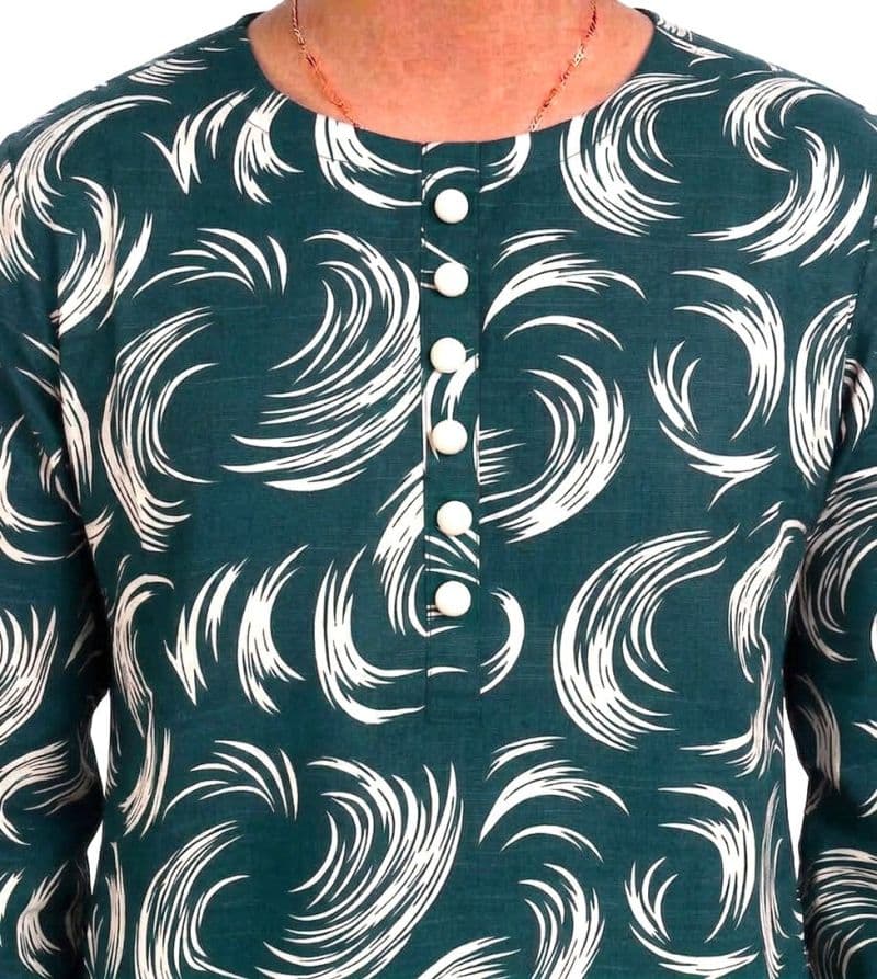 Plum Khaddar Teal Colour Printed White Patterns with White Buttons on 2pc stitched suit for Girls. thumbnail